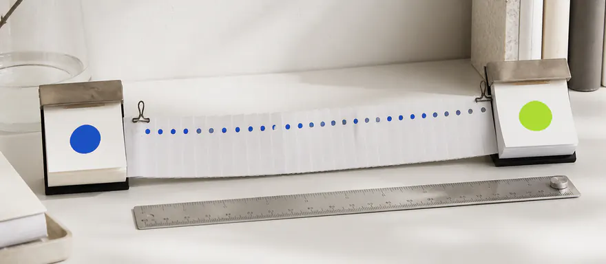 Two calendar blocks connected by a measured ribbon of individual daily markers